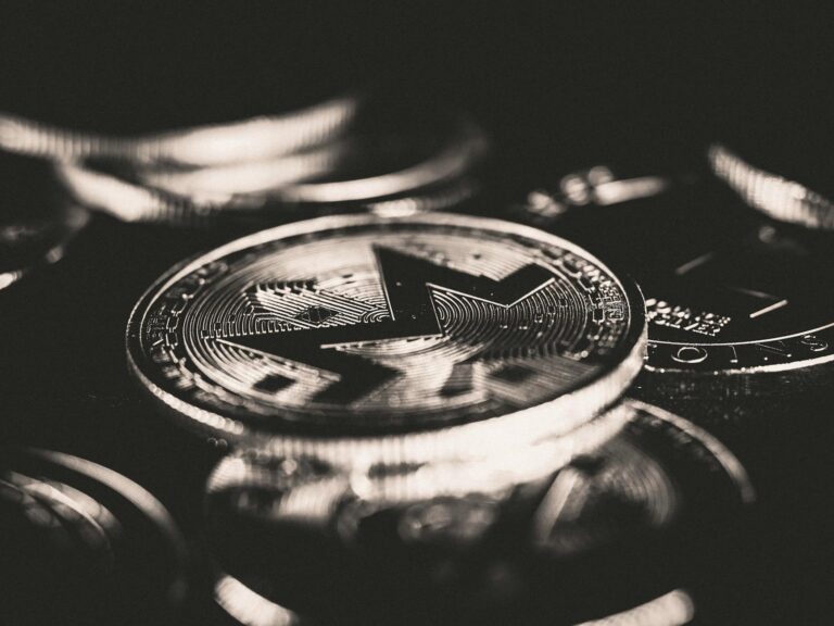 Close-up view of Monero coins showcasing cryptocurrency design with selective focus.